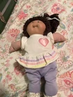 Cabbage Patch Kids Baby Doll Dark Brown Yarn Hair Heart Shirt Purple Pants