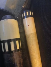 meucci pool cue used vintage- F2 with red dot shaft black amd gray in color. 