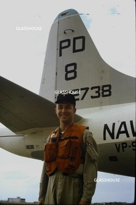 U.S. NAVY CREW MEMBER STANDING AT TAIL OF HIS ORION P-3C ORION 1966 PHOTO SLIDE