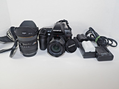 Olympus E-5 Digital SLR Camera w/ 2 lenses + 3 batteries and chargers-w/samples