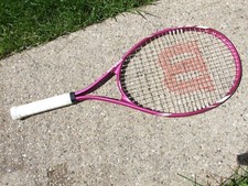 New Wilson Triumph Tennis Racquet, 4 1/4 has minor scuffs from shelf handling