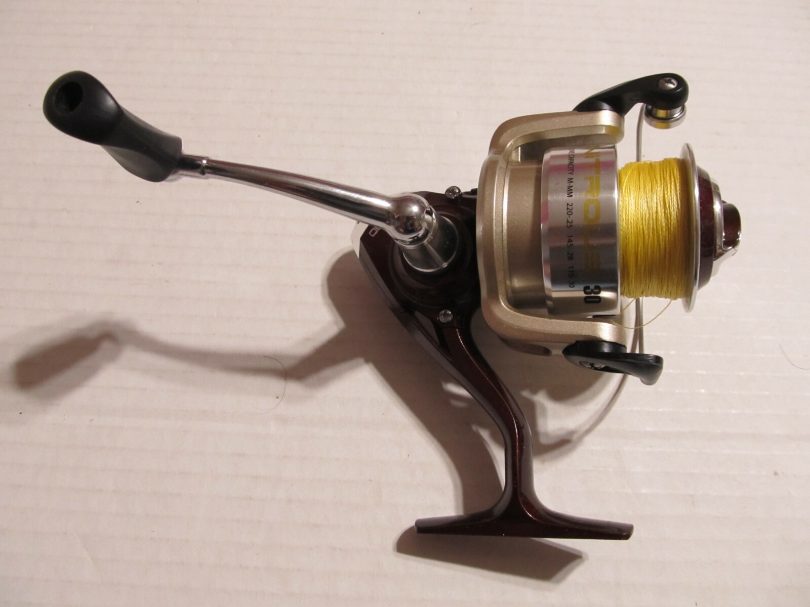 QUANTUM NITROUS 30 SPIN REEL .... WORKS GOOD.