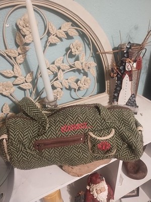 This is an Element brand bag with a green and black herringbone tweed pattern