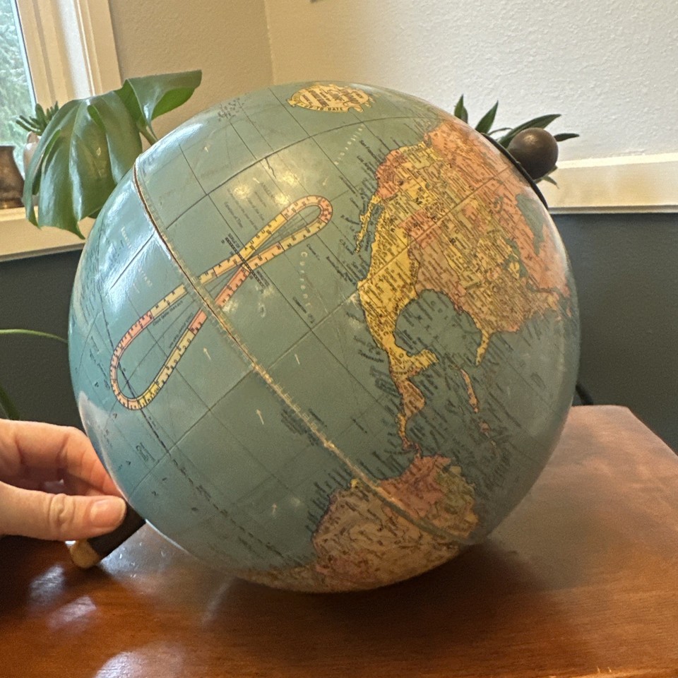 A 1935–1945 Replogle globe showing WW2-era borders including Manchukuo and expanded Germany — a genuine historical artifact frozen in time.