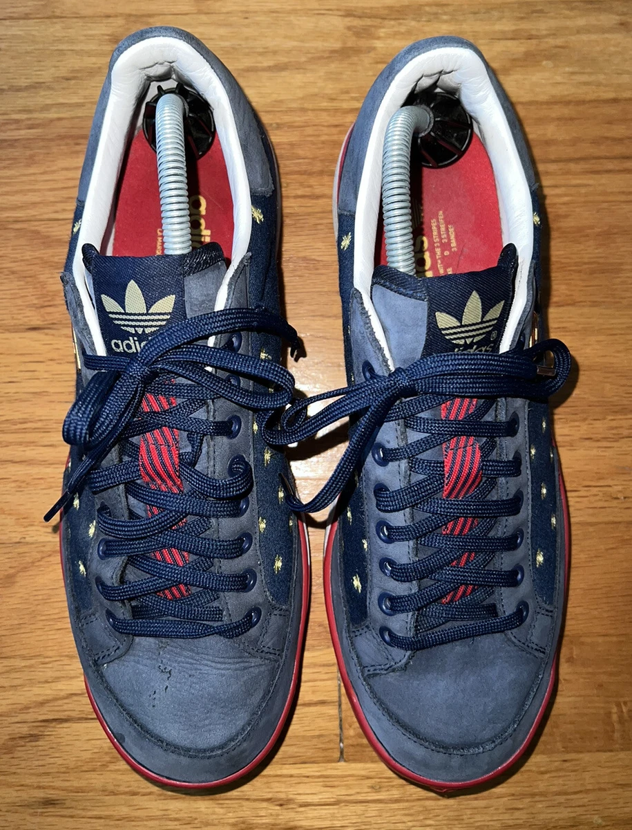 Adidas shoes with red and blue store on sole
