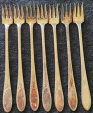7 Cocktail Forks Pattern Name Three (Silverplate 1936) by National Silver Co.