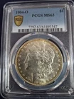 1904-O PCGS MS-63 Brilliant PCGS-Gold Shield Morgan Silver Dollar. Graded 1/2026