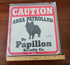 Area Patrolled by Papillon dog Security Co. sign. Plastic . 11 by 11 in.