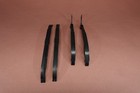 Black metal 1998-2015 Yamaha VStar V Star 650 XVS650 cam camshaft timing chain guides on a red background.