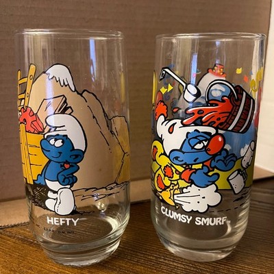 Vintage Lot 2 Clumsy Smurf 83 &Hefty 82 Peyo Smurf Drinking Glass Wallace Berrie