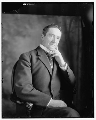 Photo:J.J. Bourne Senator Portrait Standing Suit Studio Photo