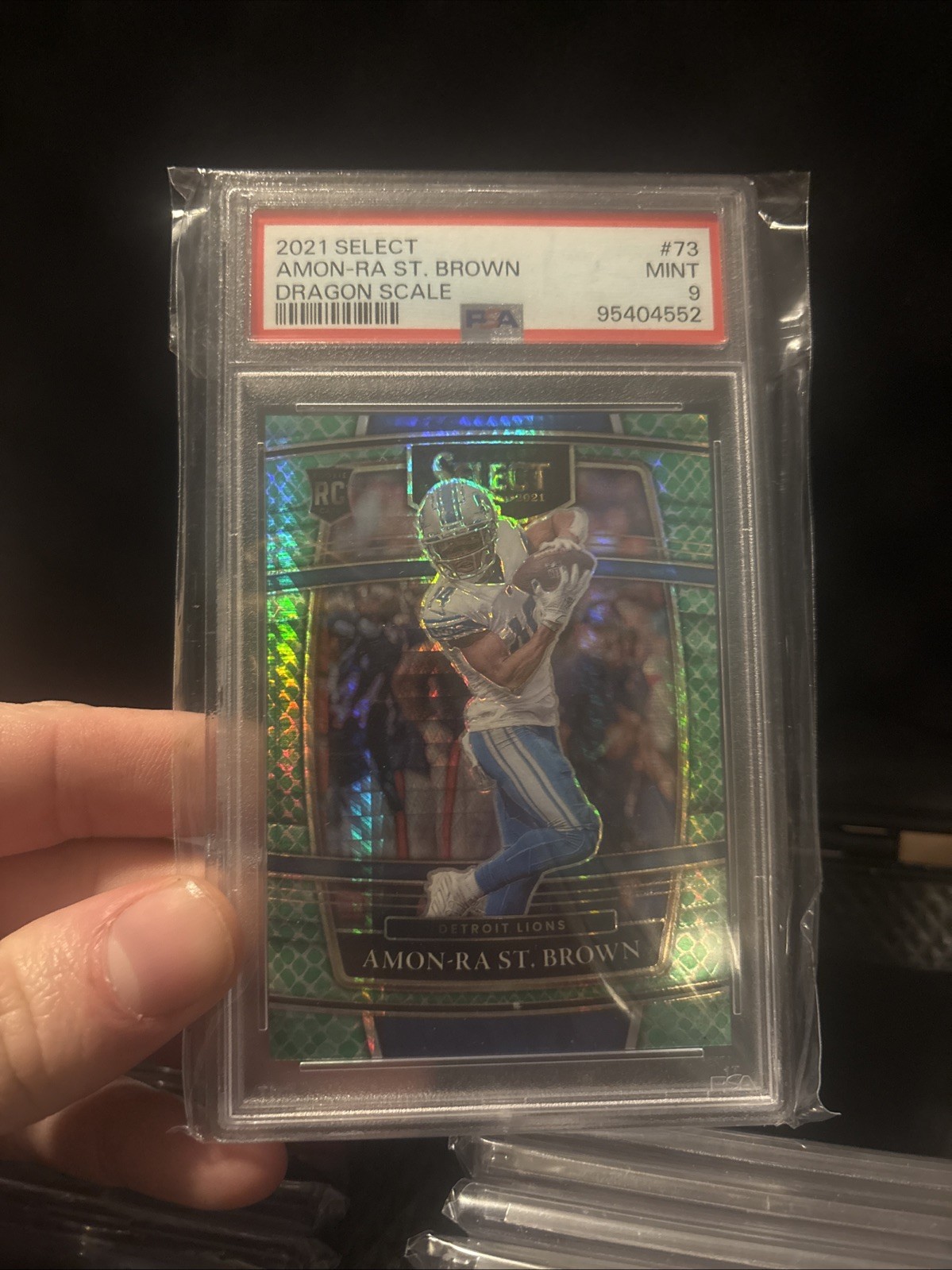 2021 Panini Select - Concourse Amon-Ra St. Brown #73 Dragon Scale Prizm /89 (RC)