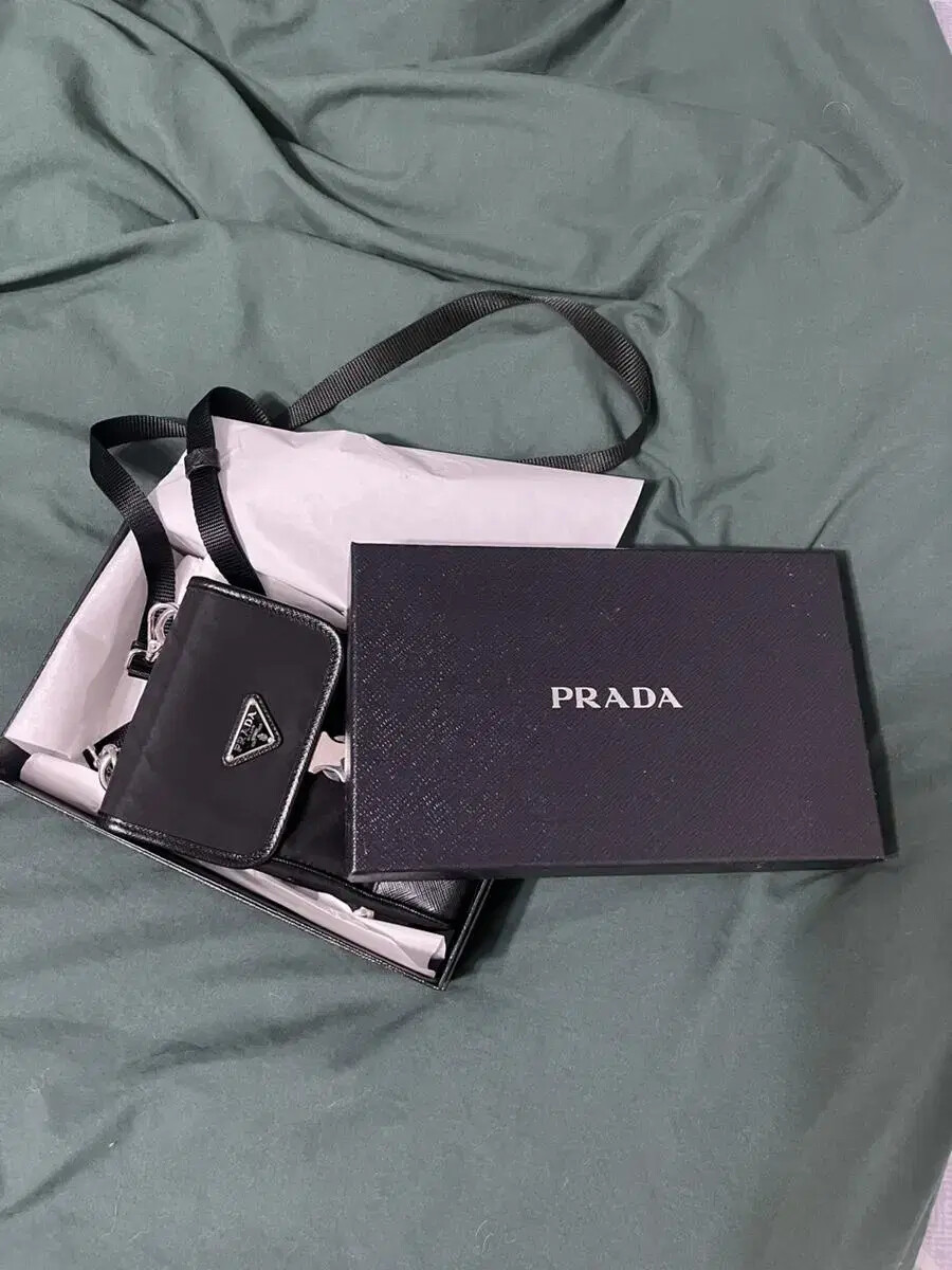 Prada Saffiano leather crossbody phone bag with luxury gold-tone hardware