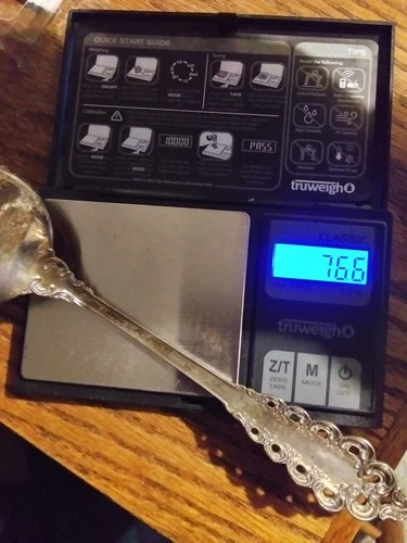 Silver under spot. Sterling silver server 76.6 grams scrap or not.