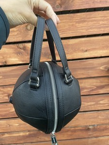 black round purse