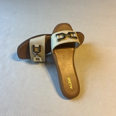 ALDO Qelajar women's flat slide sandals in white, sleek gold-tone metal 8.5