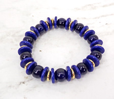 Blue glass bead stretch bracelet with gold spacer beads and blue disk beads New