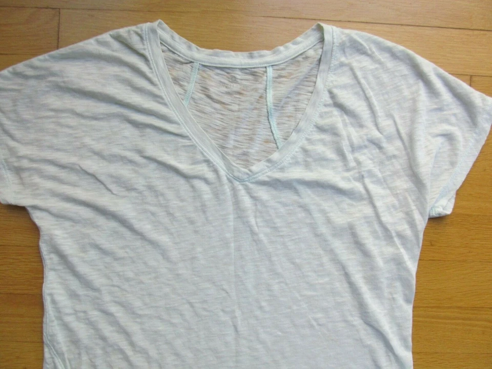 Ropa de entrenamiento atlética Athleta top y leggings cortos para mujer talla pequeña Foto 3 de 4