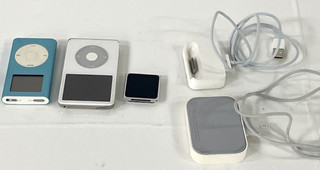 Misc. Lot of Ipods Including Charging Docks Powers On