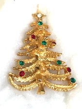 Christmas tree pin brooch gold tone marked with  X on the back not sure of maker