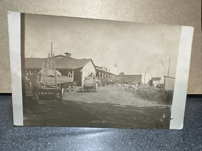 Building With Train In Background Unknown Time Or Place Real Photo Postcard RPPC