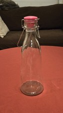 Clear Glass Swing-Top Bottle With A Cap And Metal Clasp