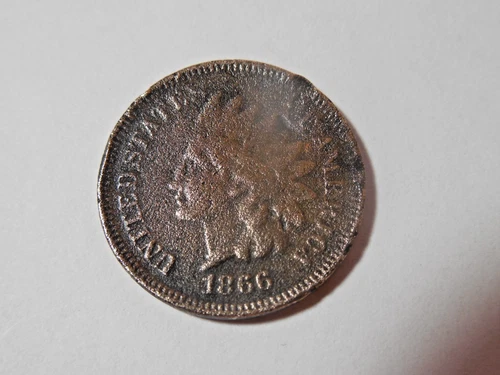 1866 Indian Head Penny in good condition. Corrosion but strong date & lettering.