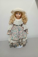 Vintage Early 1990’s porcelain doll with Blonde Hair Blue Eyes And floral dress
