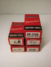 Vintage Niehoff ignition parts includes regulator fuse, contenders & brush sets.