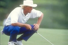 Australian golfer Greg Norman putts during the day two Kemper Open- Old Photo