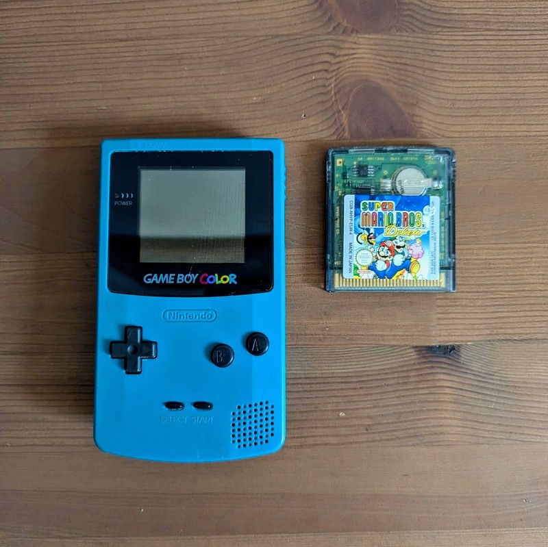Gameboy Color in Teal with Super Mario Bros Deluxe