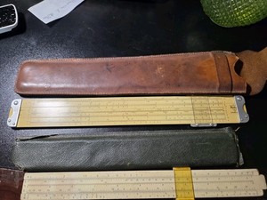 800 t slide ruler with leather case and 1766p ruler with case