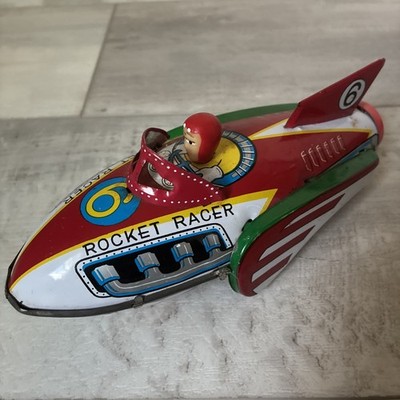 Vintage 1960s Chinese Rocket Racer Metal Toy works with clicking sound.