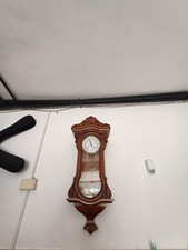 Orologio antico a pendolo da parete