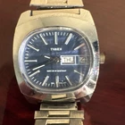 vintage 1970s Timex Marlin TV automatic watch with a blue dial and day-date