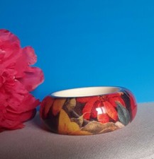 "ROBERTO CAVALLI" Bracciale rigido, materiale plastica lucite, diametro 10 cm.