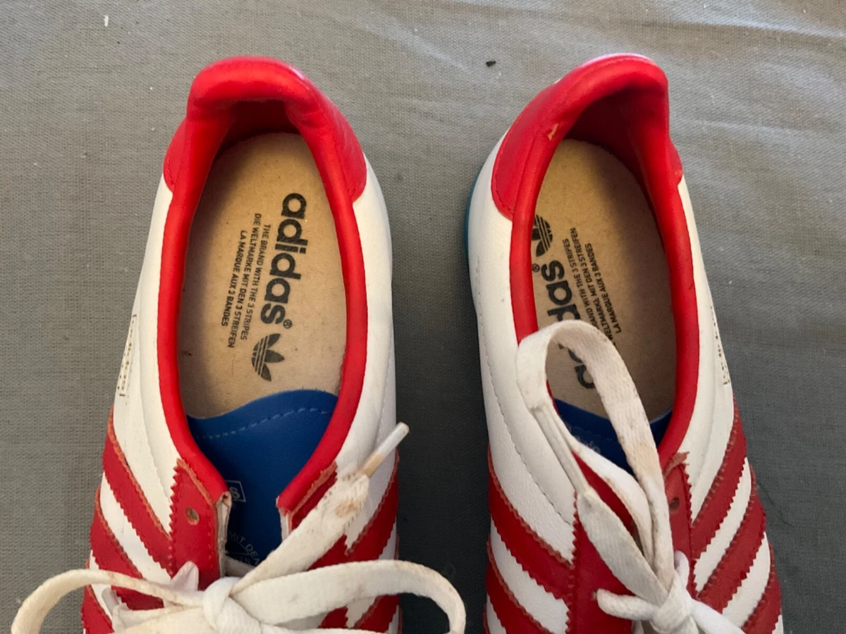 Adidas with blue deals and red stripes