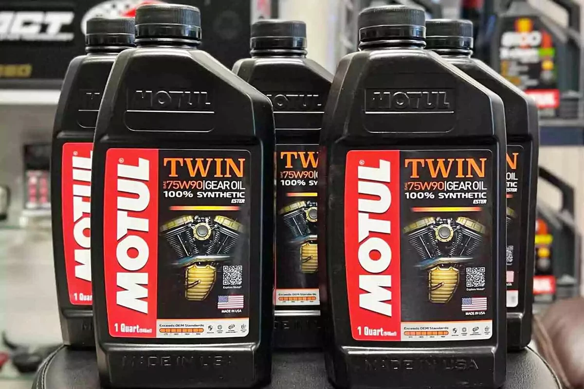 Five new bottles of Motul synthetic gear oil.