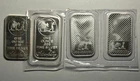 4- 1 Oz. silvertowne silver bars. 3 In Original Package, 1 Loose With Toning