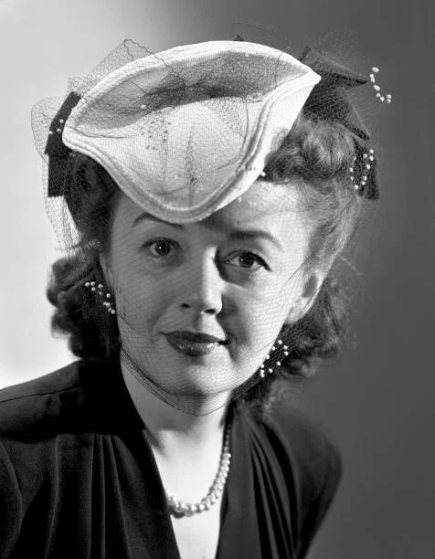 Radio actress Dolores Gillen modeling hat fashion She performs o