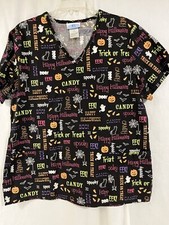 Halloween short sleeve pull over scrub top. Black w/ orange, green, purple words