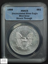1999 American Silver Eagle ASE $1 (STRUCK THROUGH MINT ERROR) ANACS MS UNC