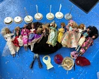 11 Vintage Barbies with accessories and stands. Read description