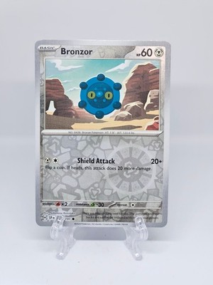 126/191 Bronzor | Common Reverse Holo | Surging Sparks Pokemon Karte