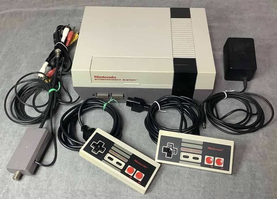 Complete tested NES bundle with controllers and cables — ready to plug in and play Duck Hunt on a Friday night.