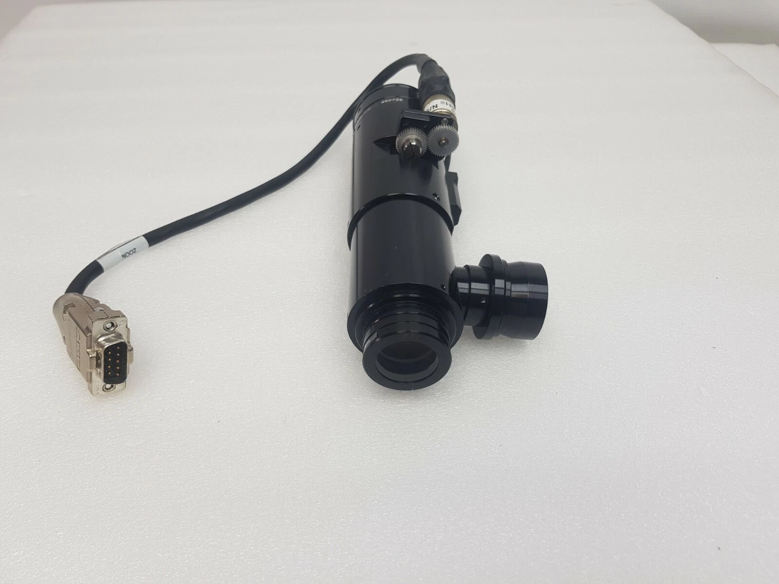 Navitar zoom assembly standing upright with motor cable and D-sub connector