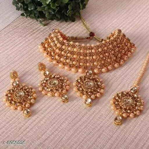 Party wear gold necklace clearance