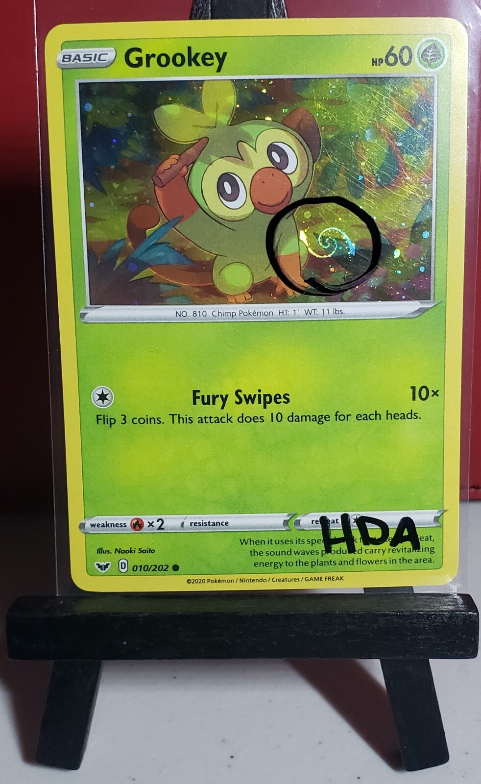 HD Swirl Grookey 010/202 Cosmos Holo Rare Sword & Shield Pokemon Card - LP HDA