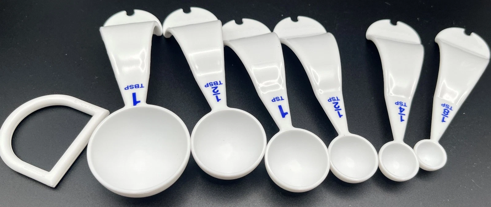 Tupperware Measuring Spoons Set 6 w/D Ring White W/Blue Markings NEW
Opens in a new window or tab
