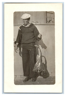 1908 USS Montana Sailor Holding Dead Stingray on Deck Real Photo P17